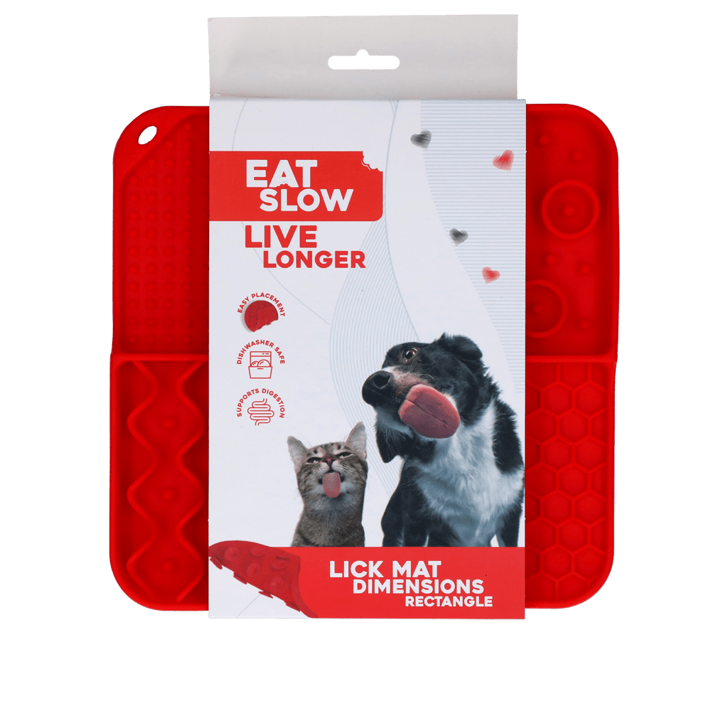Red lick mat with packaging featuring a dog and cat, and text &