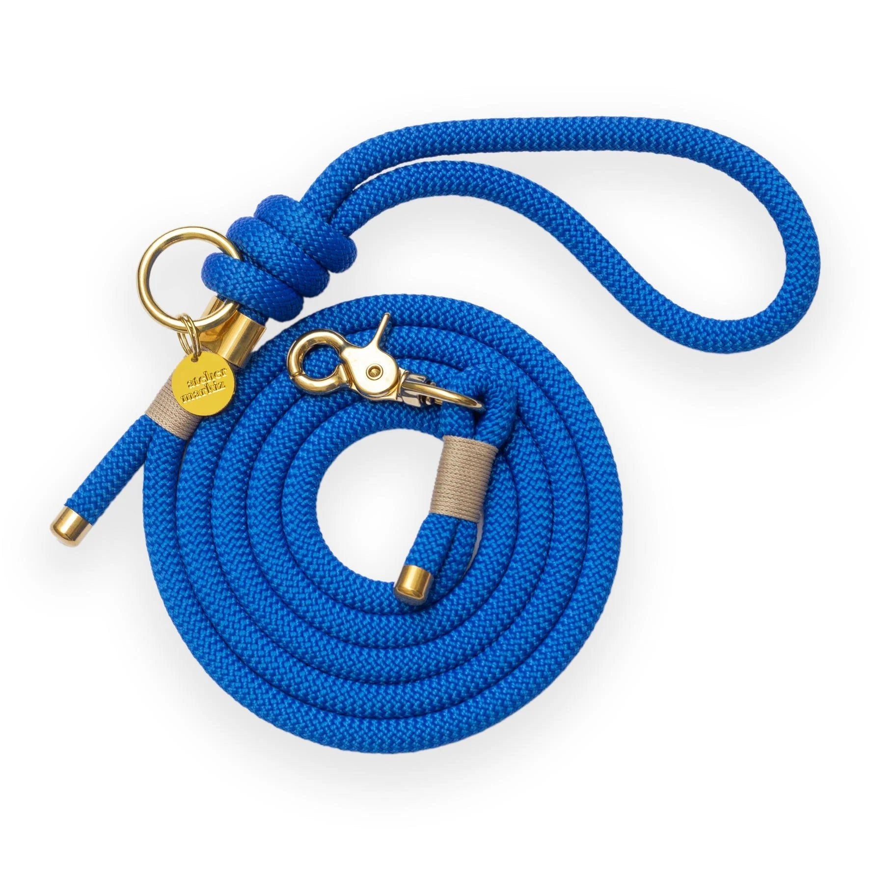 Blue dog leash with gold hardware on a white background