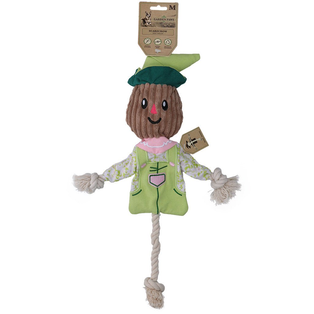 Scarecrow-shaped toy with a green hat and outfit on a white background