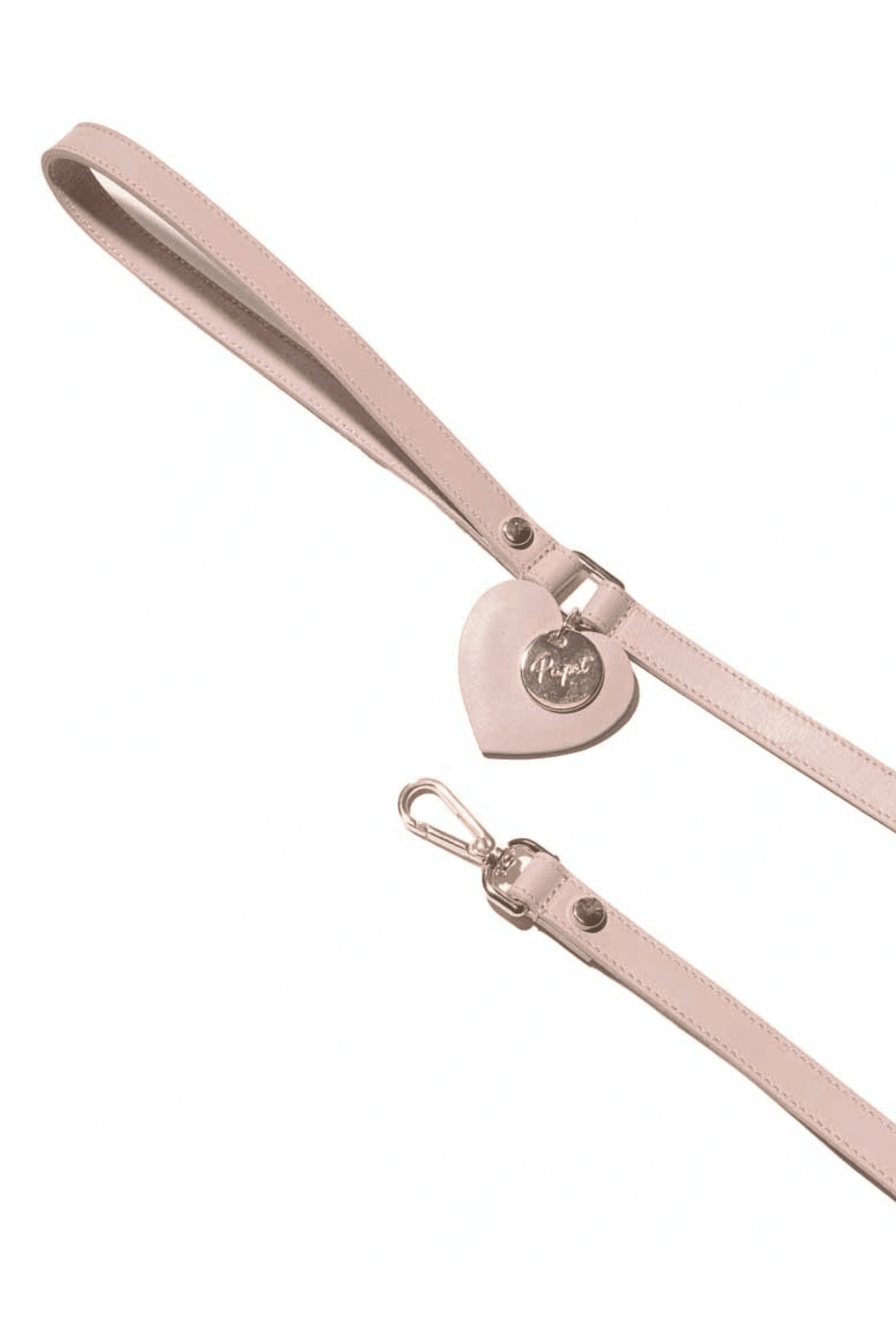 Pink dog leash with a heart-shaped tag on a white background