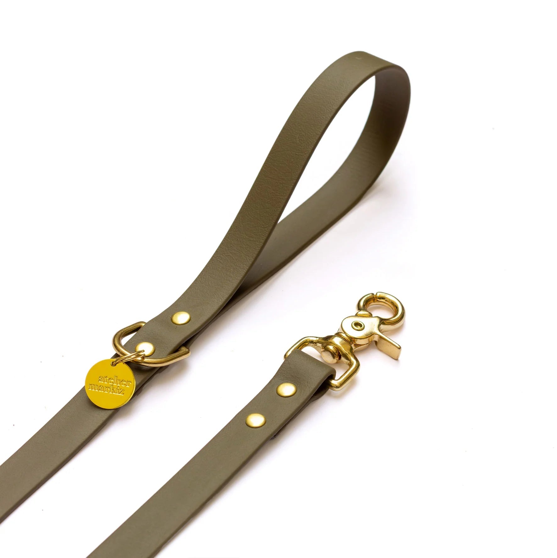 Green leather strap with gold hardware on a white background