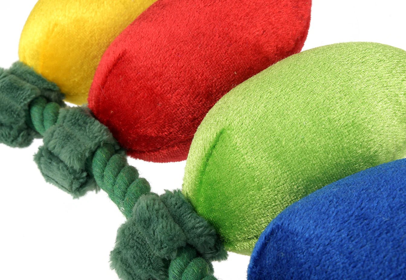 Colorful dog toy with fleece balls and a rope on a white background
