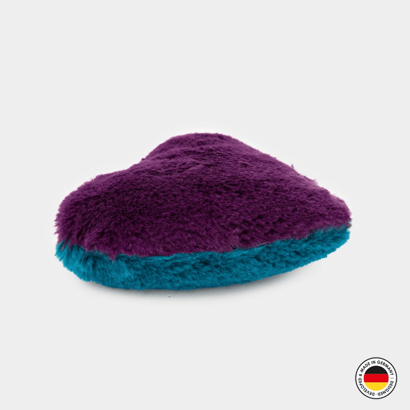 Purple and teal fuzzy slipper on a light gray background