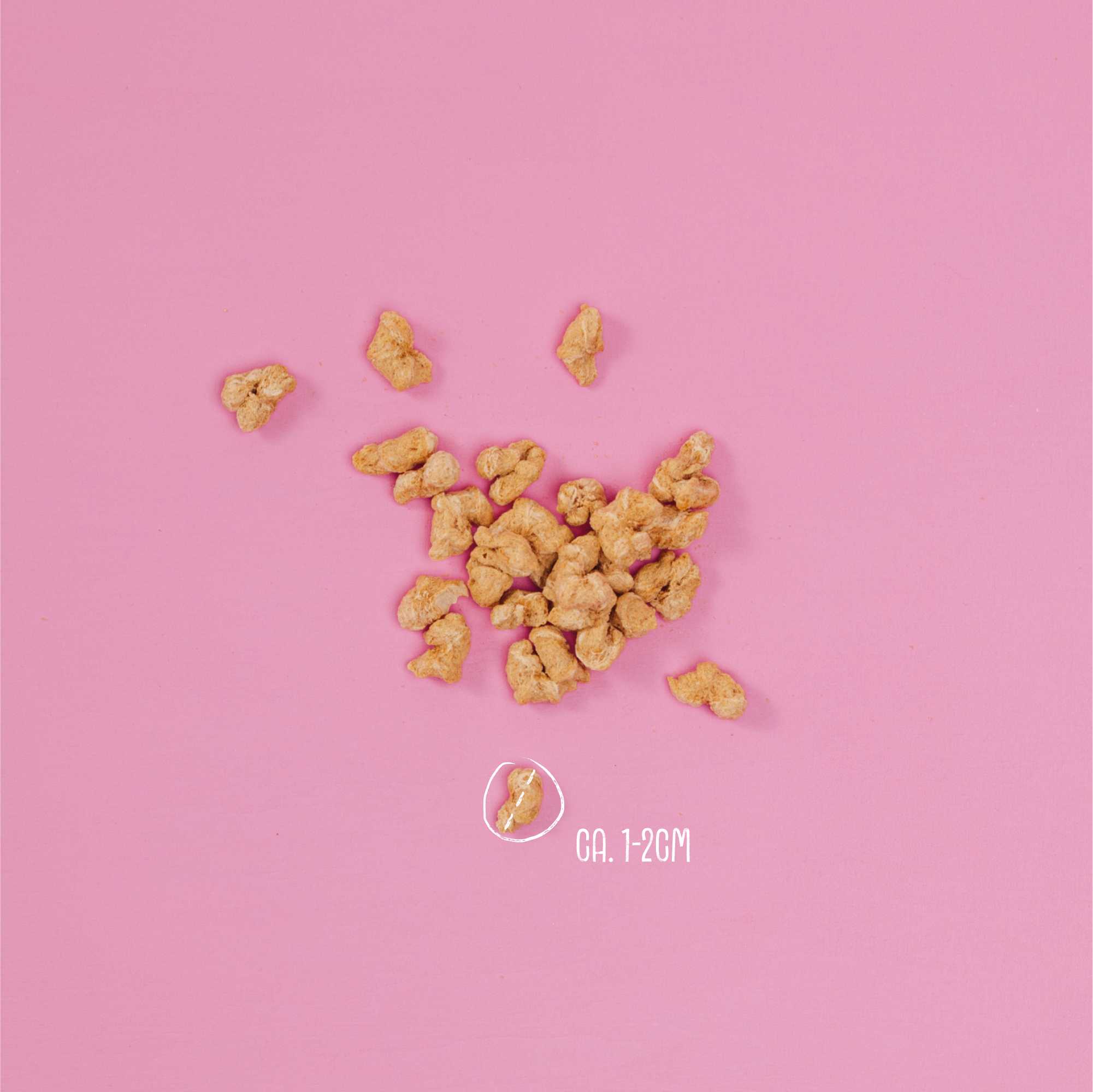 Crispy snacks on a pink background with a size label indicating &