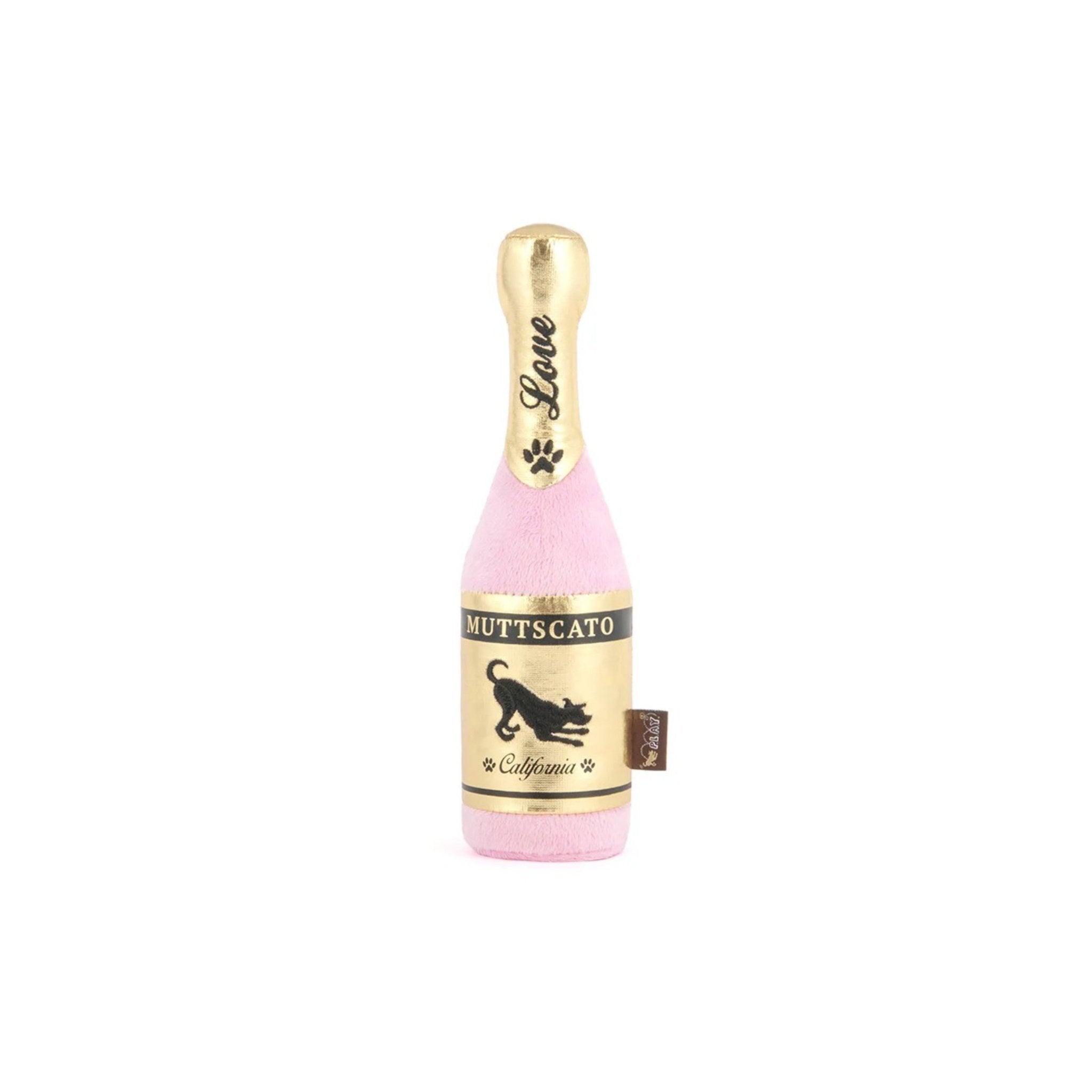 Dog toy shaped like a bottle of Muttscato wine on a white background