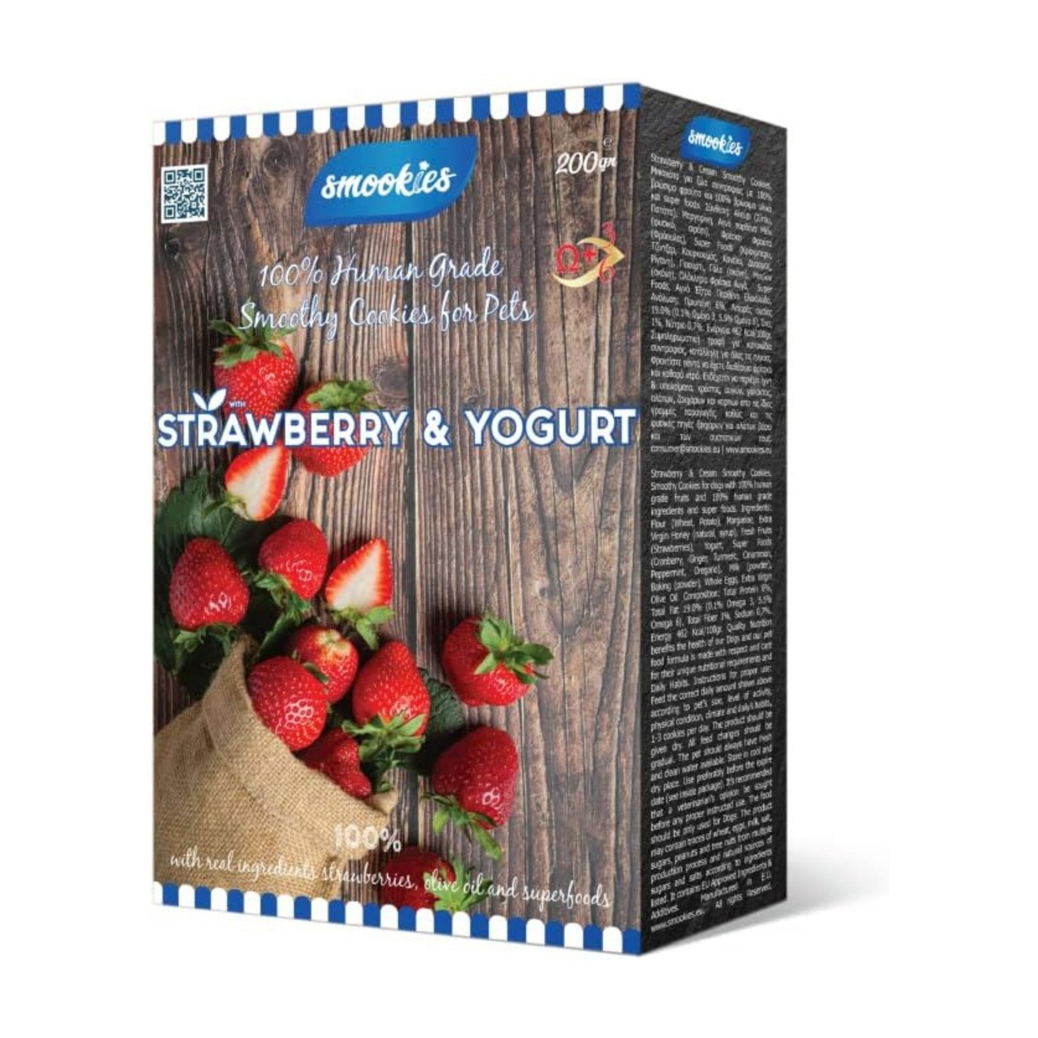 Box of strawberry and yogurt flavored cookies for pets with visible strawberries on a wooden background.