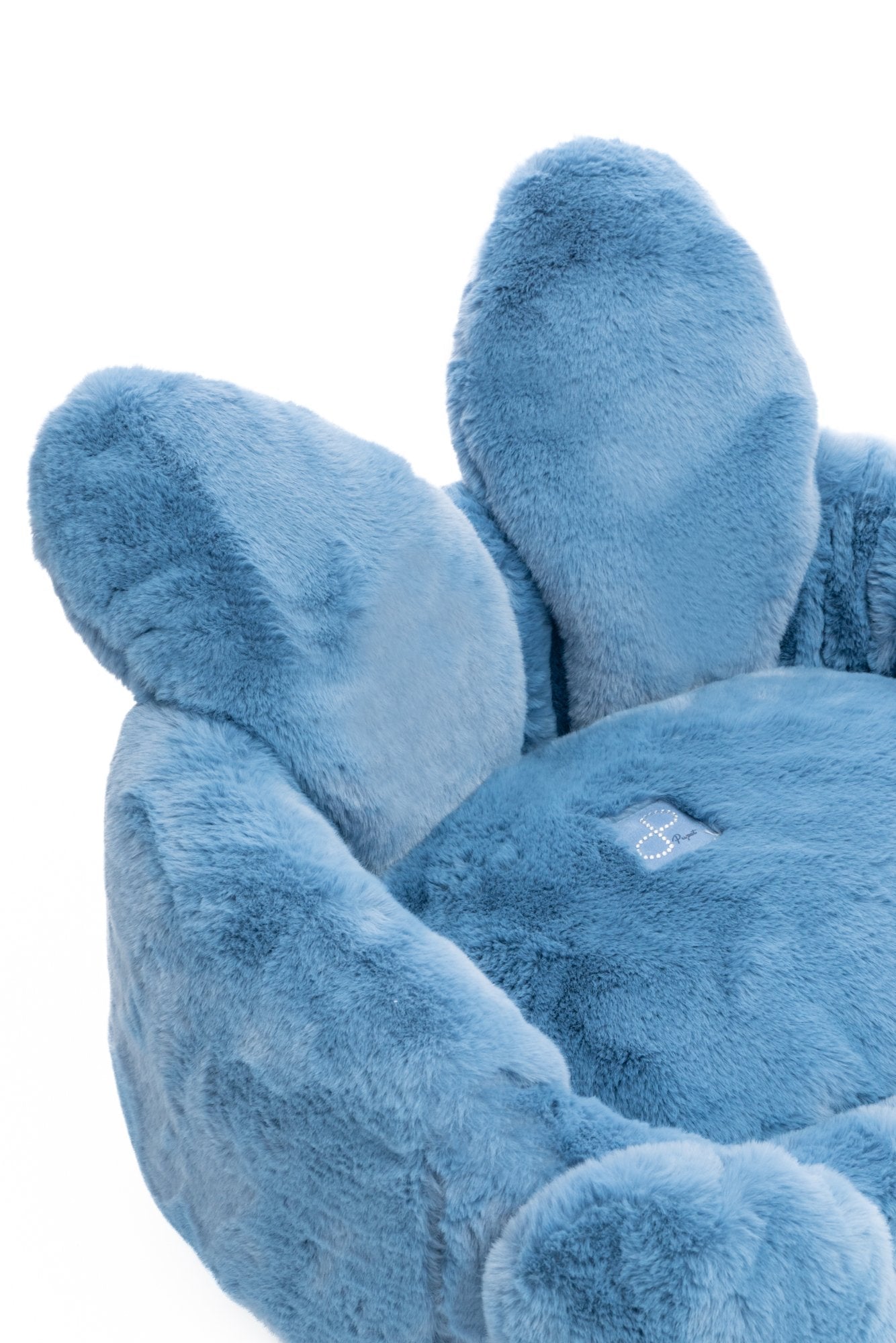 Blue plush chair on a white background