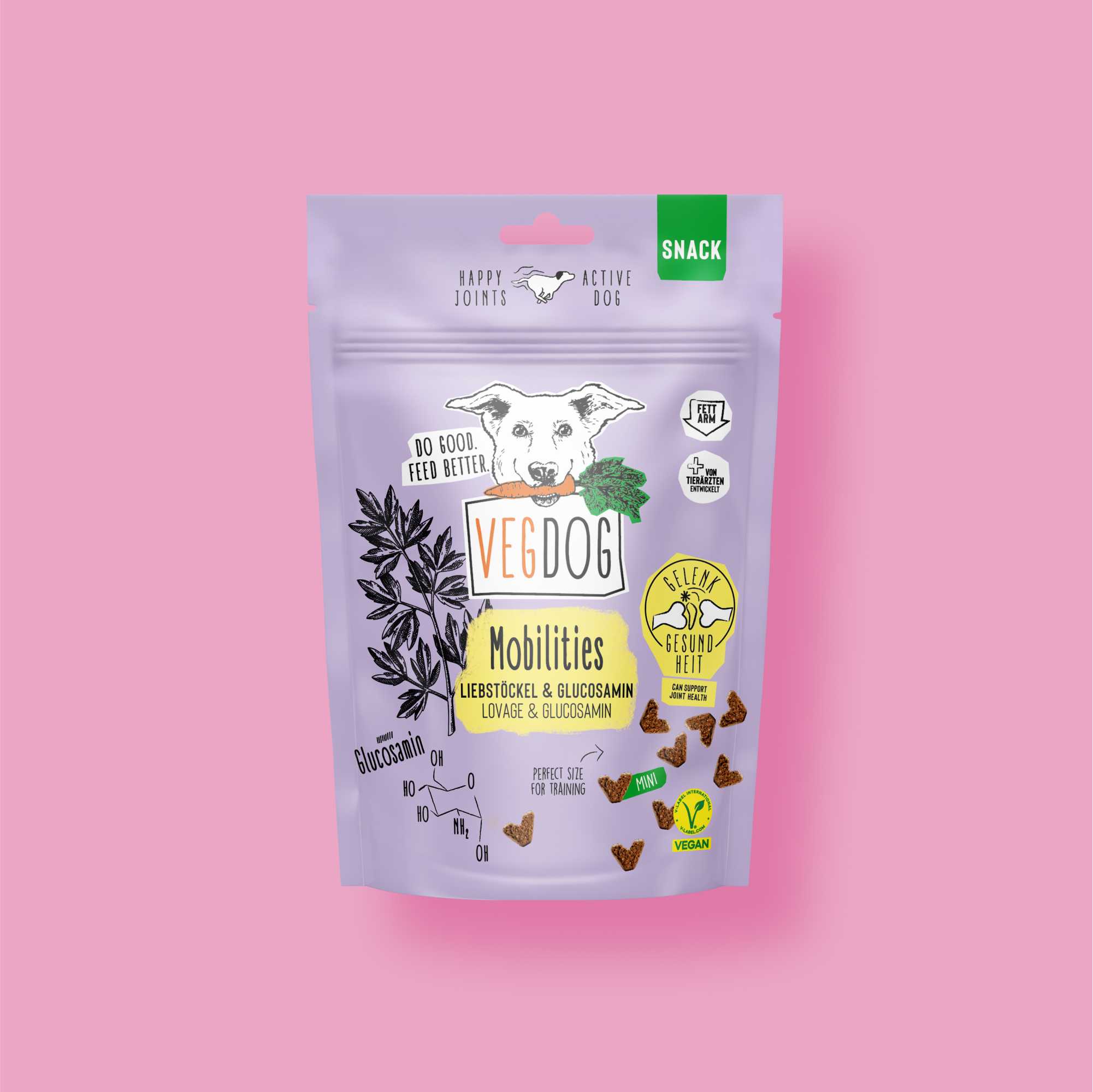 VegDog snack package on a pink background