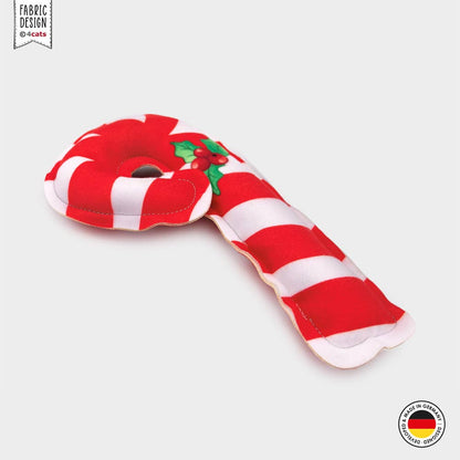 Red and white striped candy cane-shaped toy on a light gray background