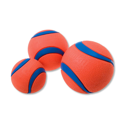 Three orange rubber balls with blue bands on a white background