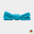 Turquoise bow tie on a light gray background
