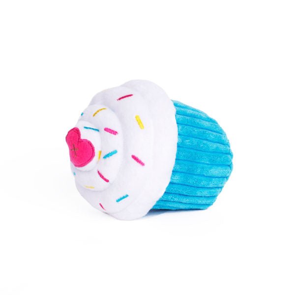 Toy resembling a cupcake with a donut on top against a white background