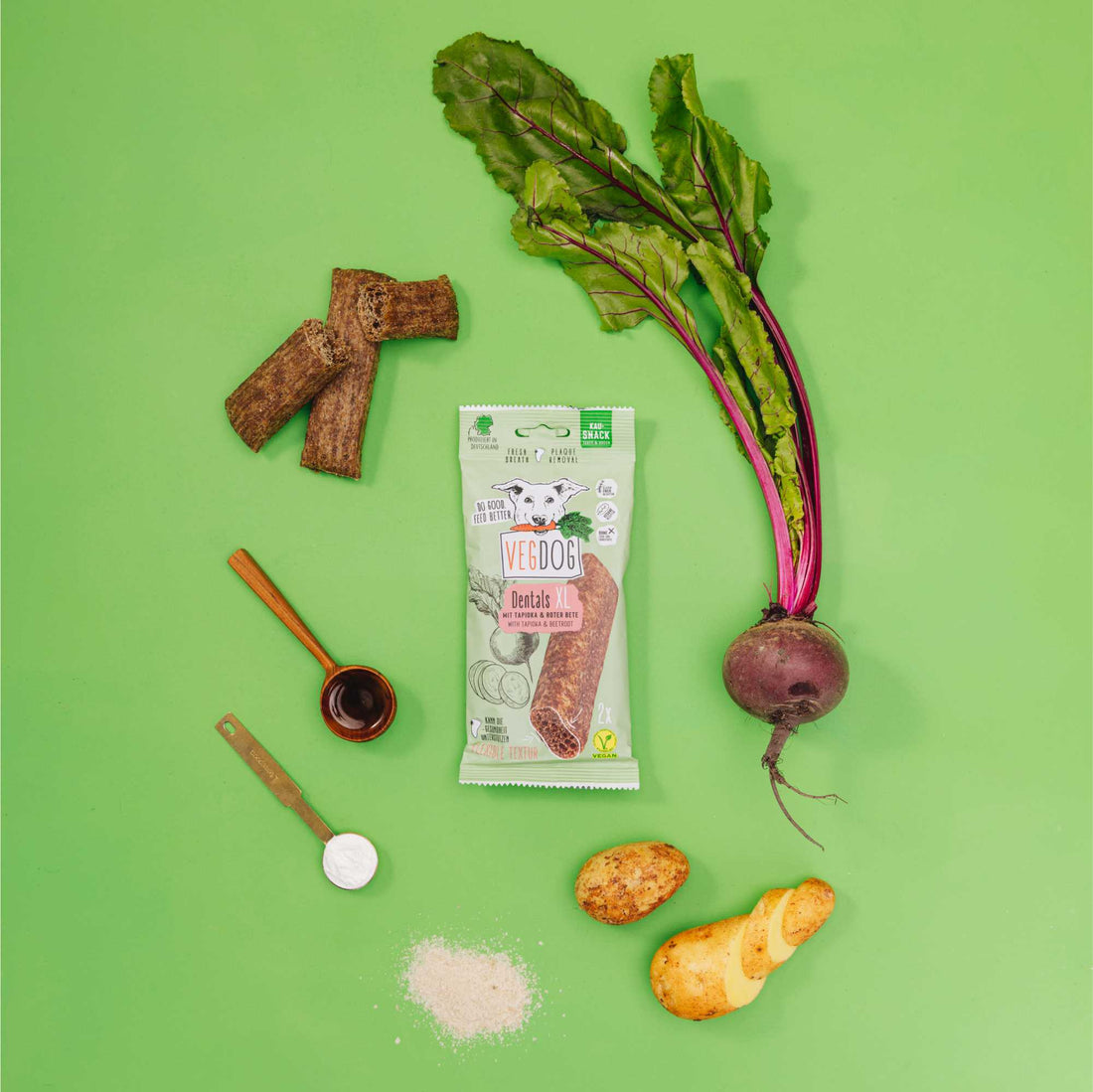 Vegetable ingredients and a package on a green background