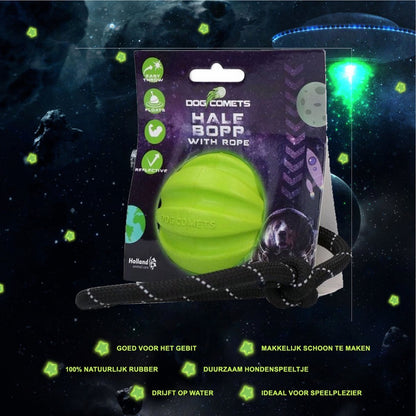 Green ball with rope in its packaging on a space-themed background