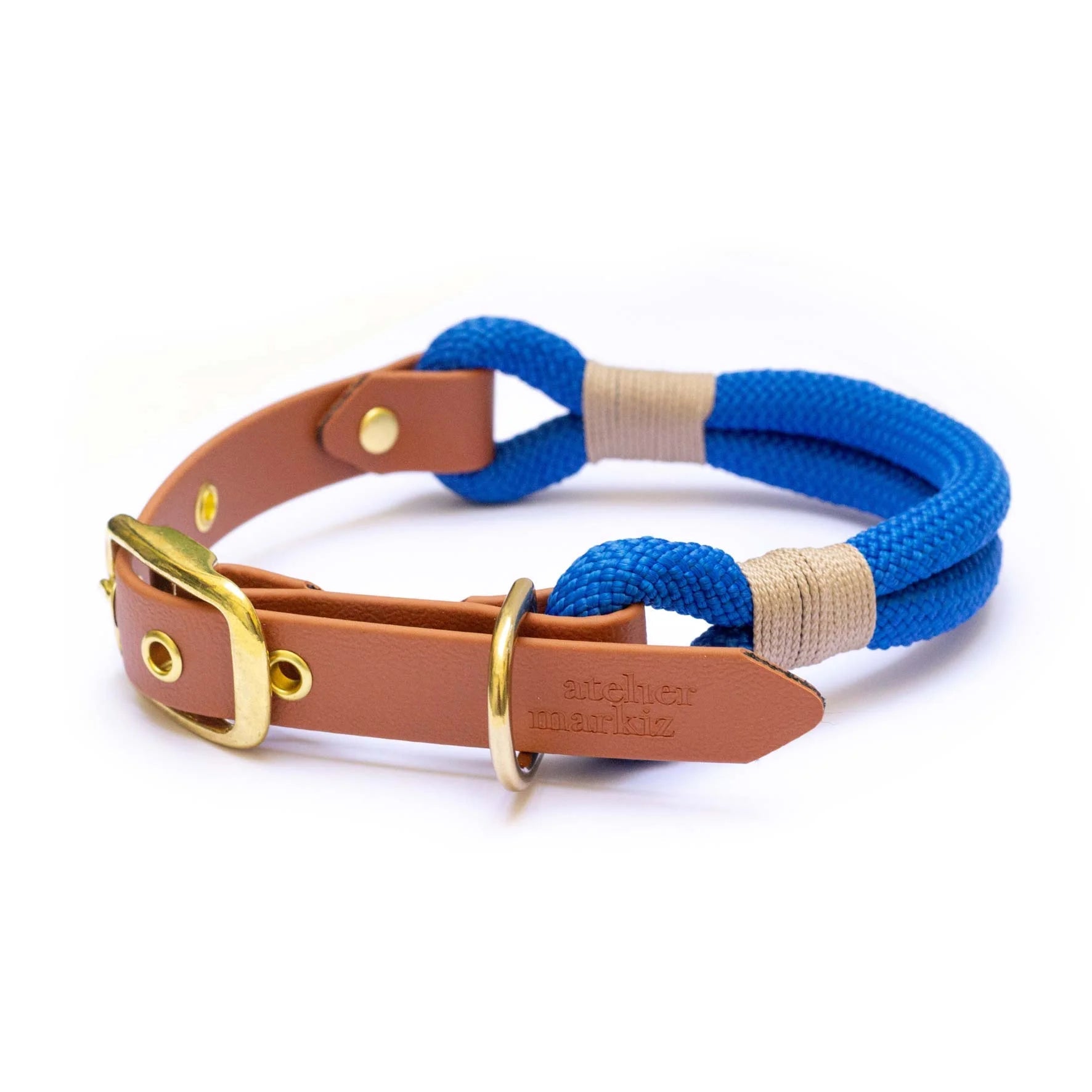 Dog collar with blue rope and brown leather strap on a white background
