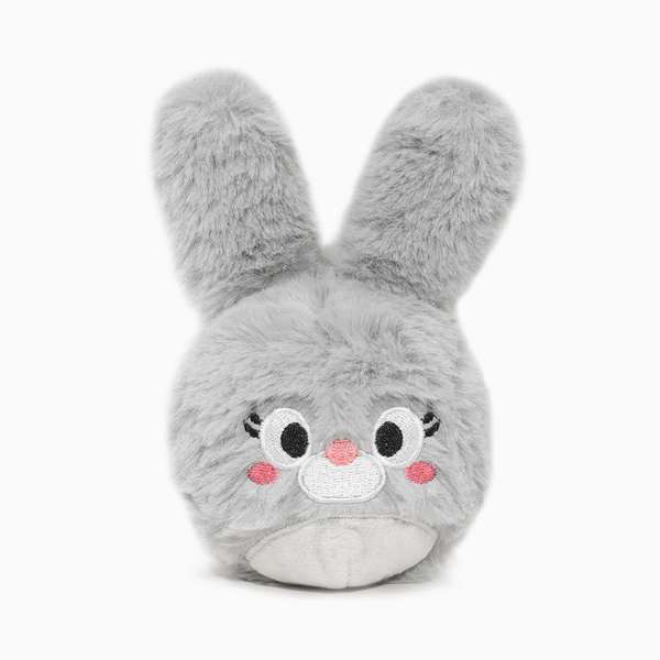 Plush toy with a cute face on a white background