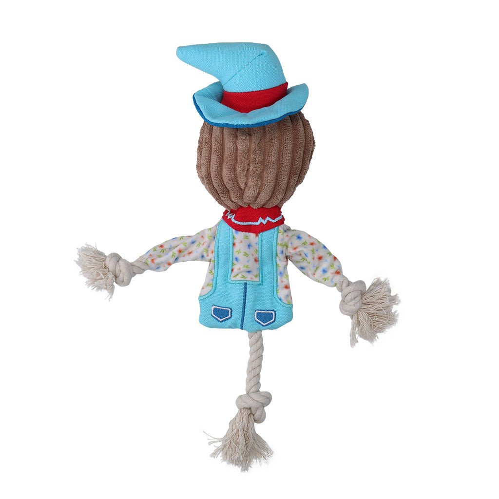 Toy scarecrow with a blue hat and vest on a white background