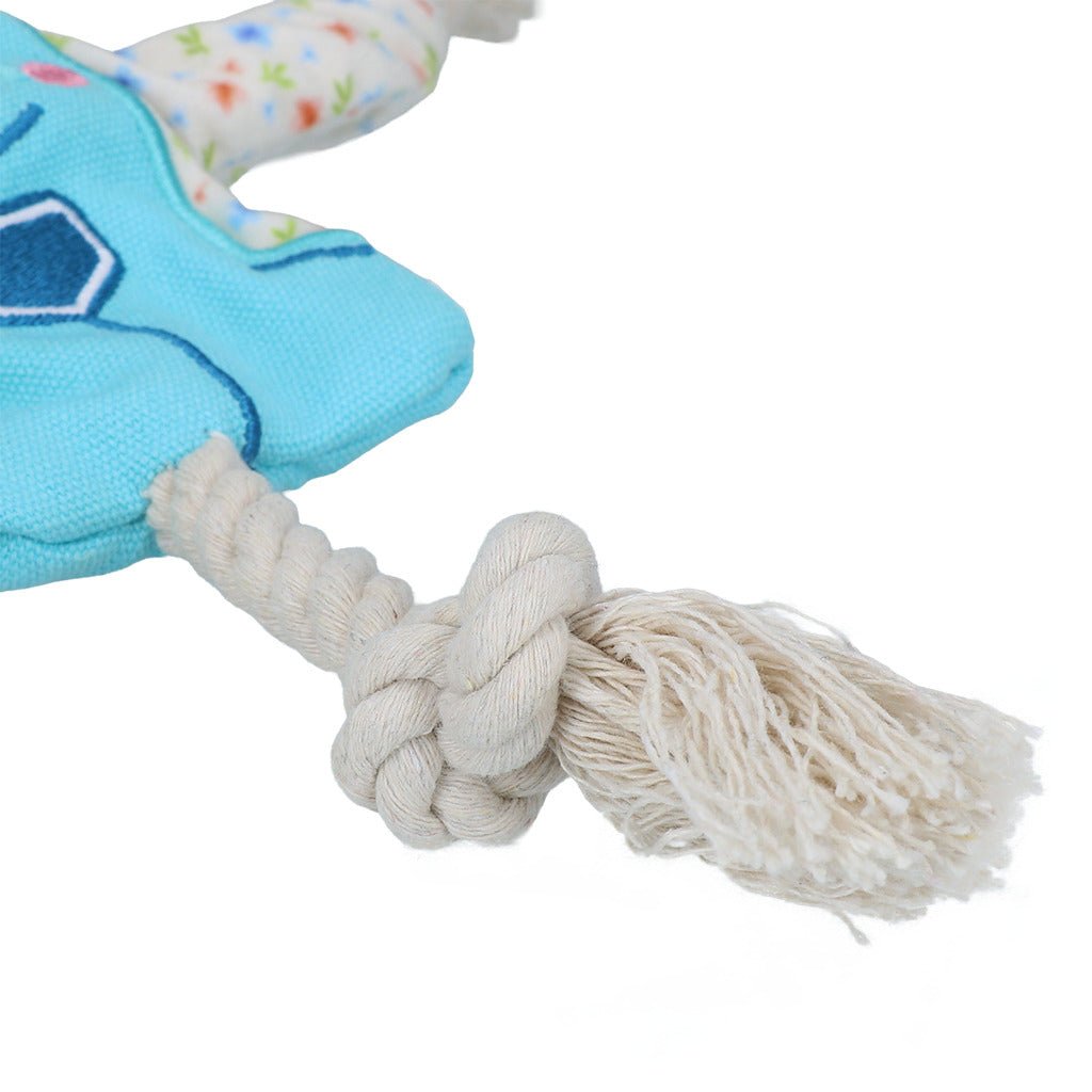 Blue turtle plush toy with a rope on a white background