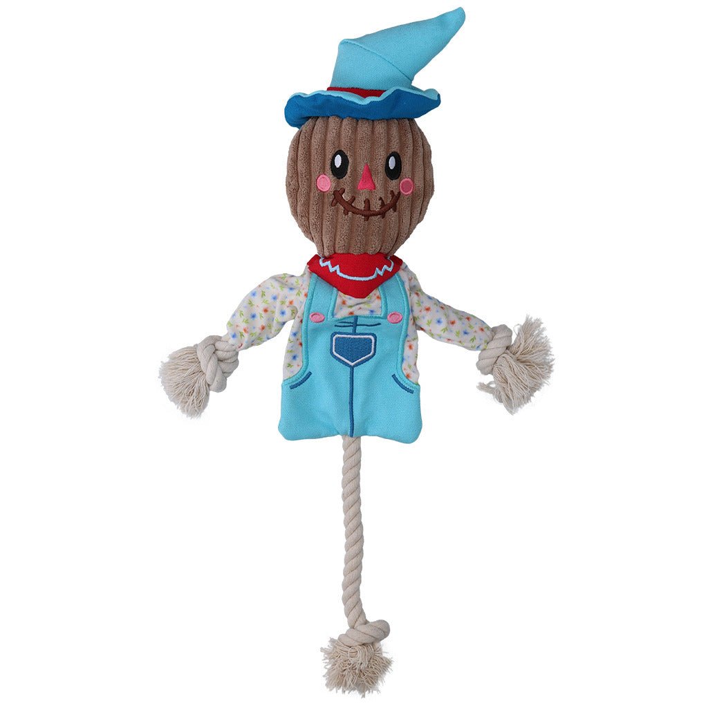 Scarecrow-shaped plush toy with a blue hat and outfit on a white background