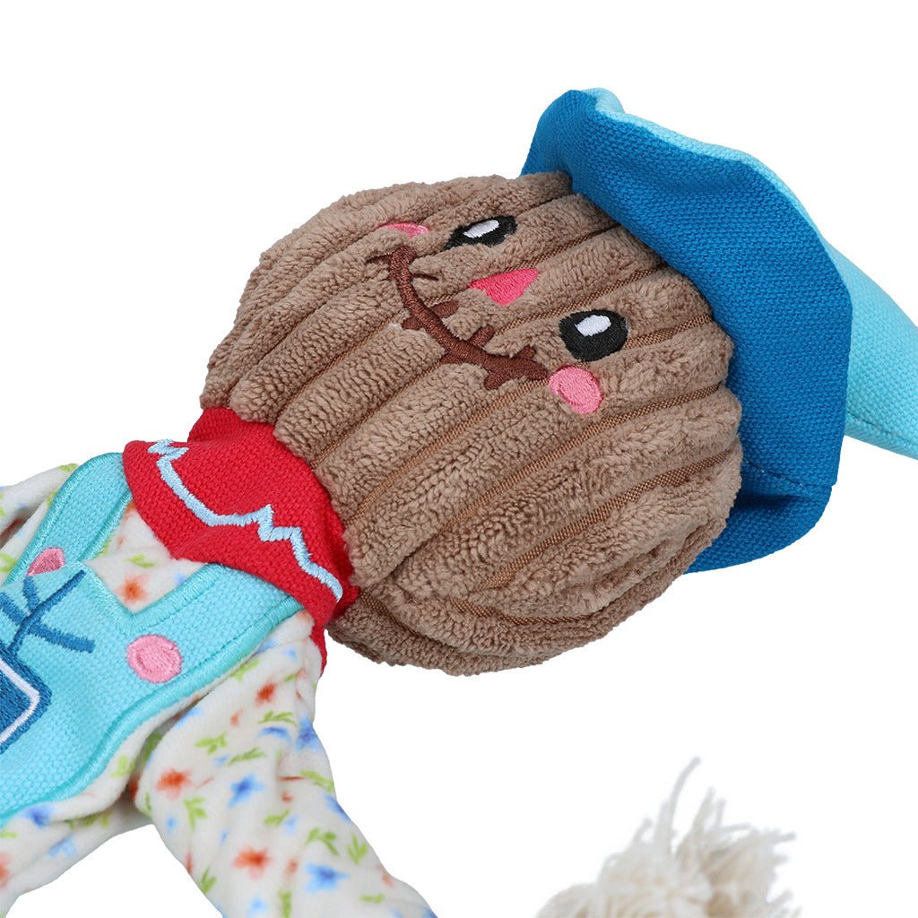 Plush toy with a brown bear face and colorful clothing on a white background