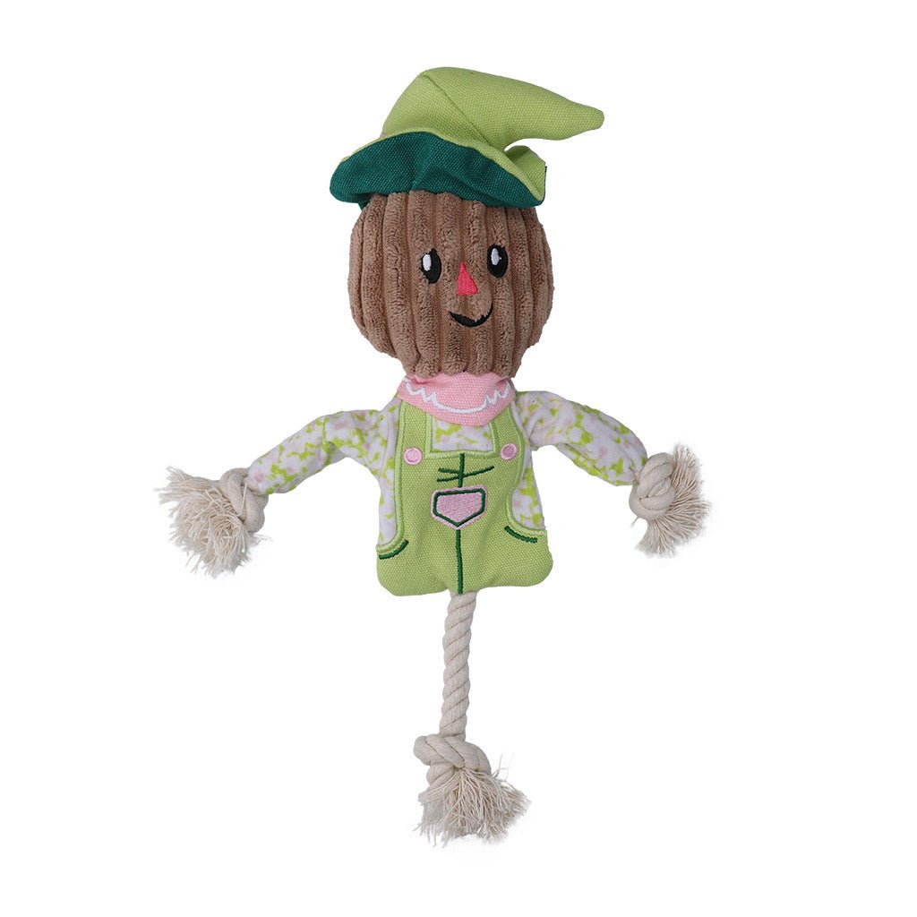 Scarecrow-shaped toy with a green hat and outfit on a white background