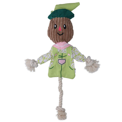 Toy scarecrow with a green hat and outfit on a white background