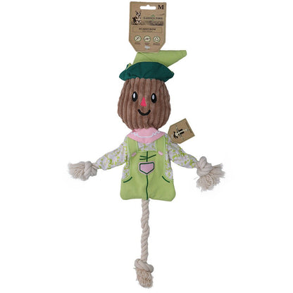 Scarecrow-shaped toy with a green hat and outfit on a white background