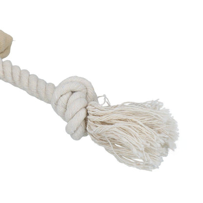 White rope dog toy with a knot and tassel on a white background