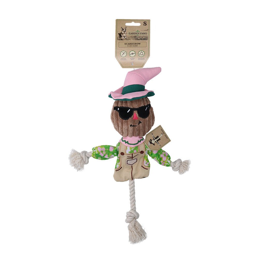Scarecrow-shaped dog toy with sunglasses and a sign, on a white background