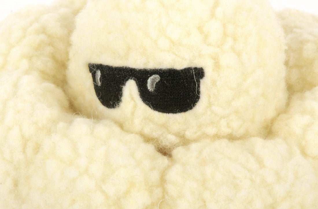 Plush toy popcorn wearing sunglasses on a white background