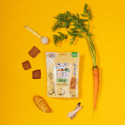 Veggie dog jerky package with a carrot and other treats on a yellow background