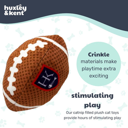 Plush football-shaped cat toy with crinkle materials, featuring Huxley &amp; Kent branding.
