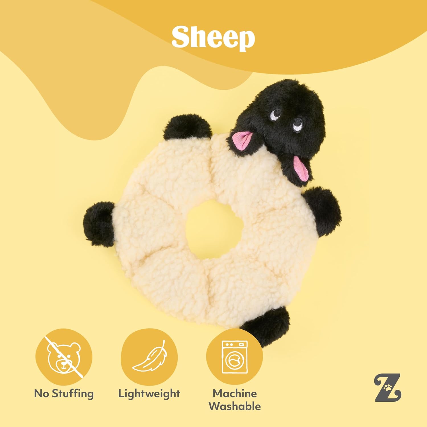 Plush sheep toy with black face and paws on a yellow background, featuring Zara branding.