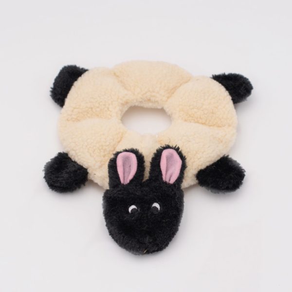 Plush toy shaped like a sheep with a beige ring on a white background
