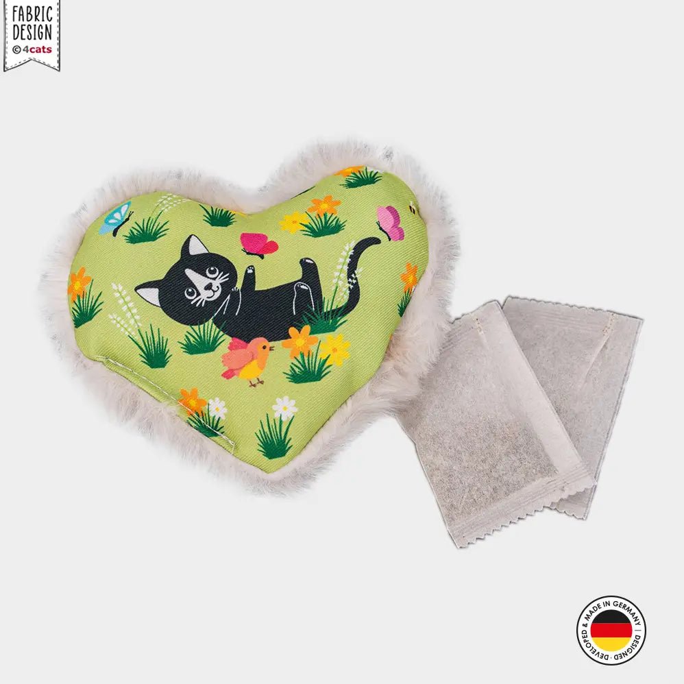 Heart-shaped catnip toy with a black cat design on a white background