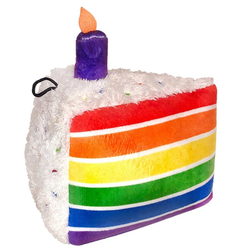 Plush toy shaped like a rainbow birthday cake with a purple candle on a white background