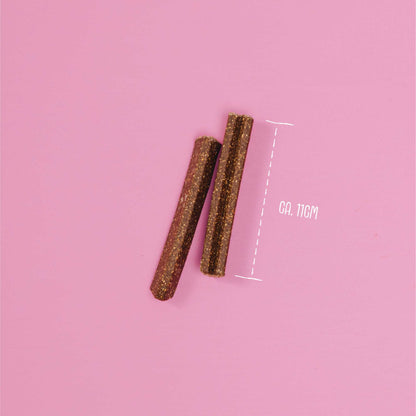 Two cylindrical objects on a pink background with a measurement label.
