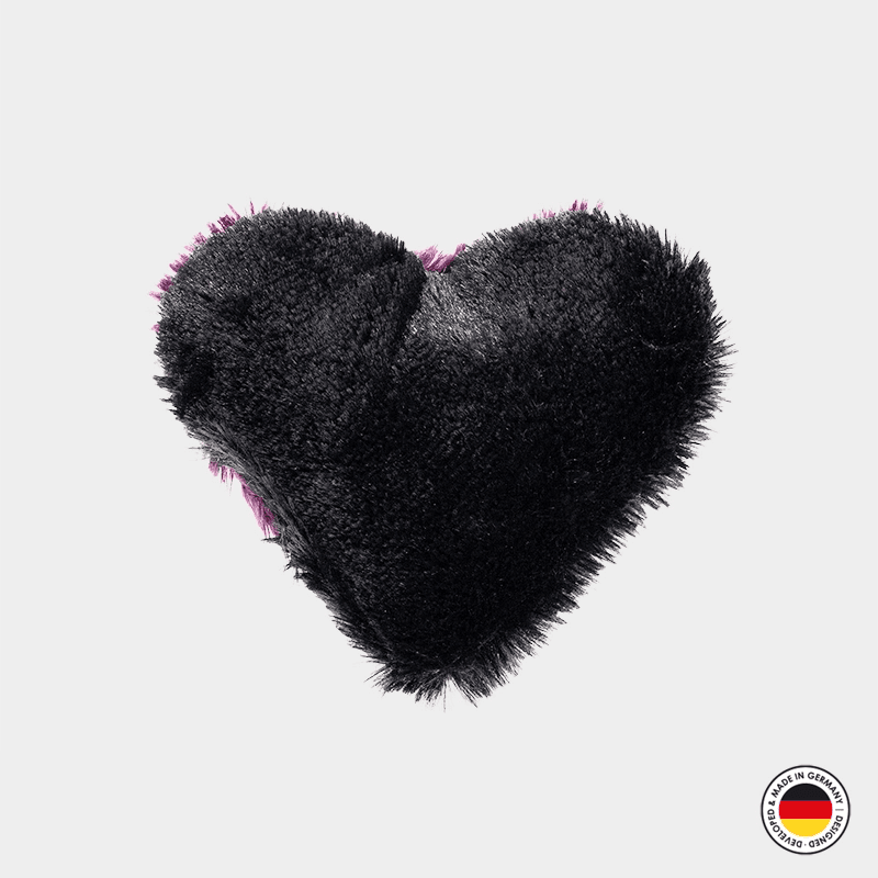 Black fluffy heart-shaped object on a light gray background with a brand logo in the corner.
