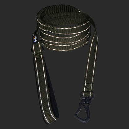 Reflective dog leash with black clip on a dark background