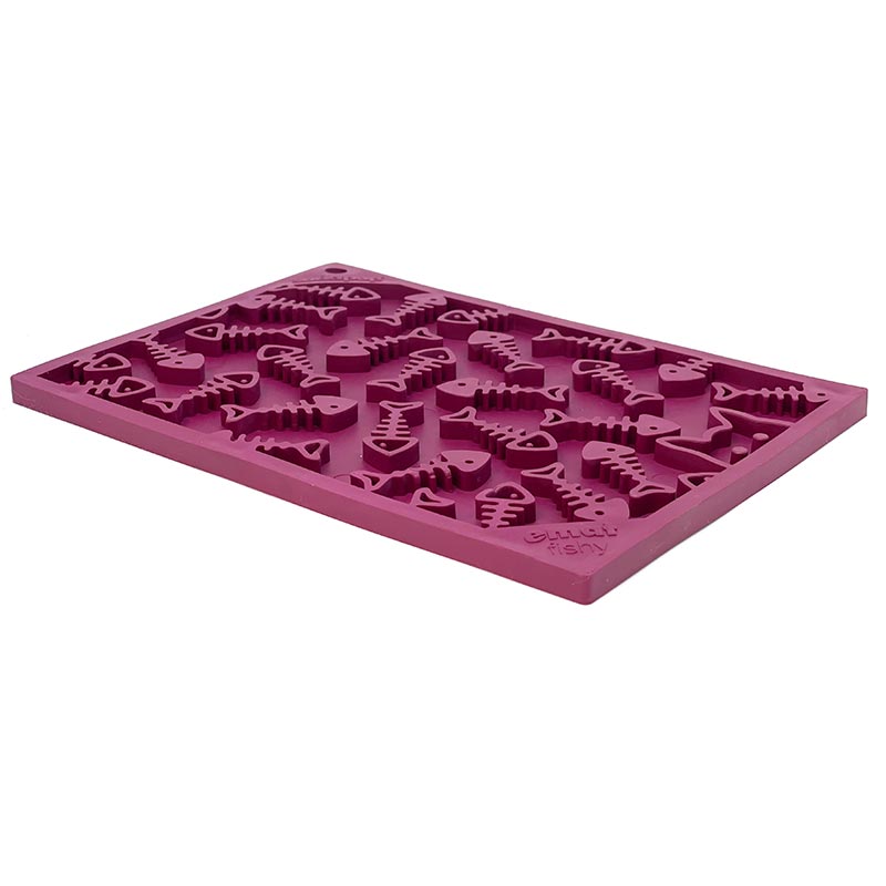 Pink silicone mold with various shapes on a white background