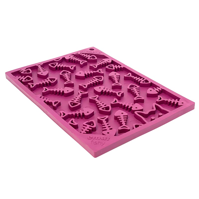 Pink silicone mold with fish and bone designs on a white background