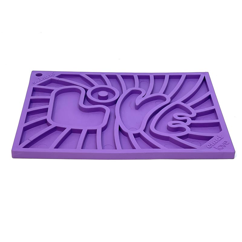 Purple silicone mold with abstract design on a white background