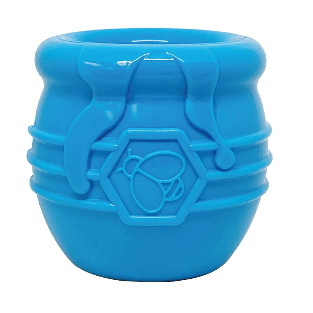 Blue silicone ice cube tray with a geometric design on a white background