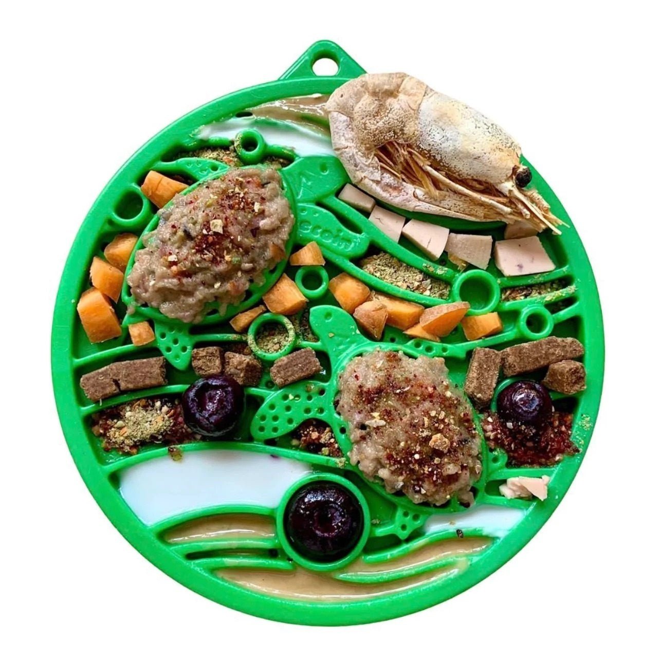 Green pet toy with various treats and toys on a white background