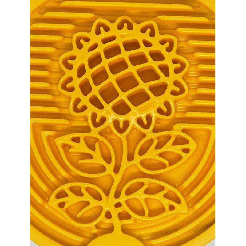 Yellow floral design on a textured surface