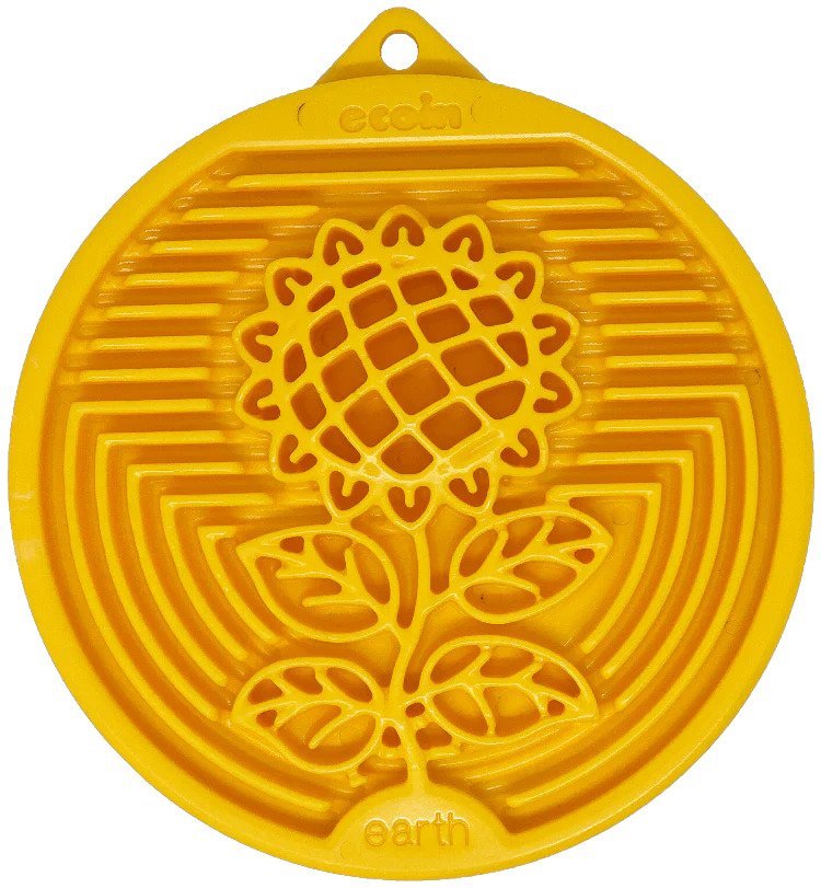 Yellow silicone mat with floral design on a white background
