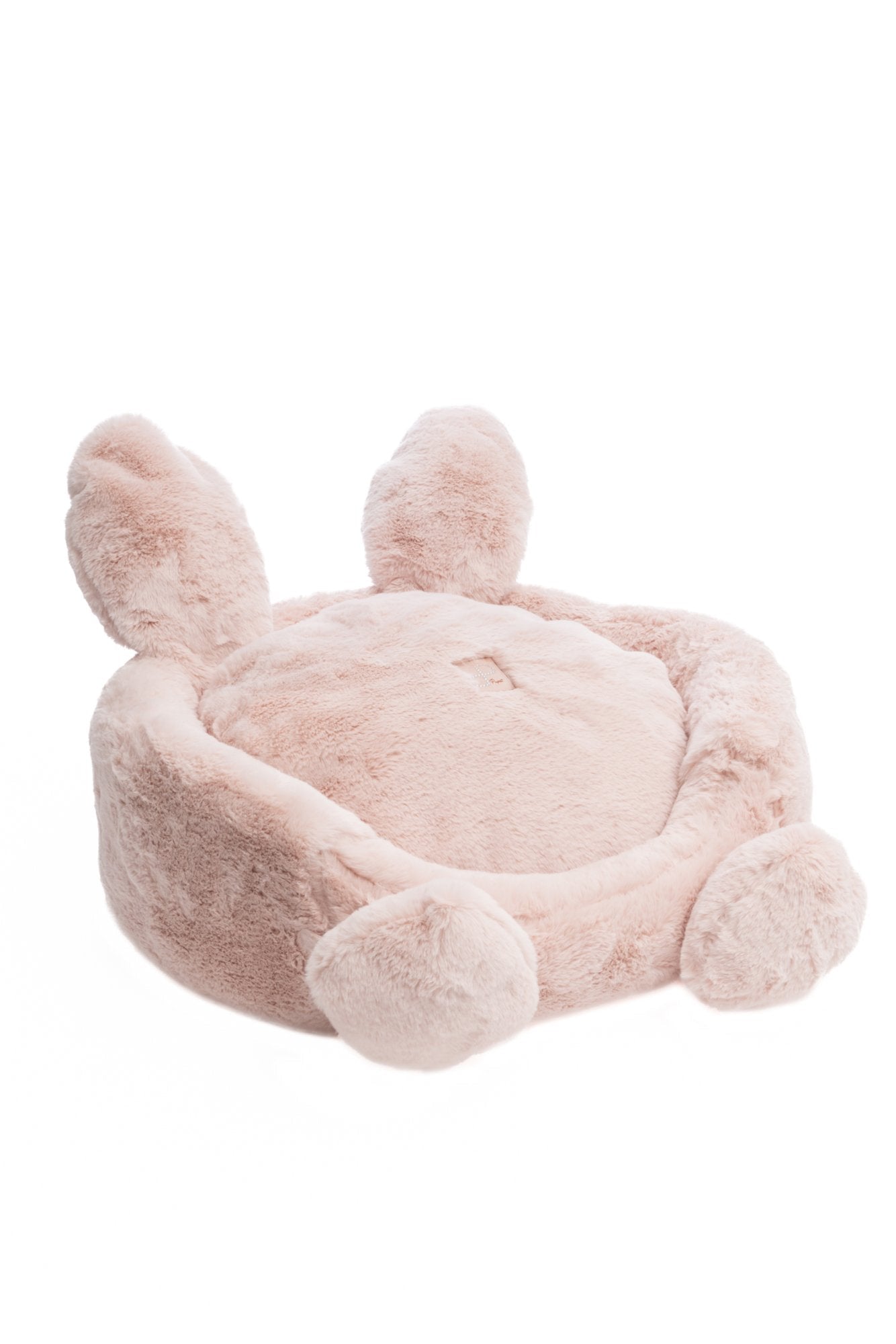 Pink plush pet bed with bunny ears on a white background