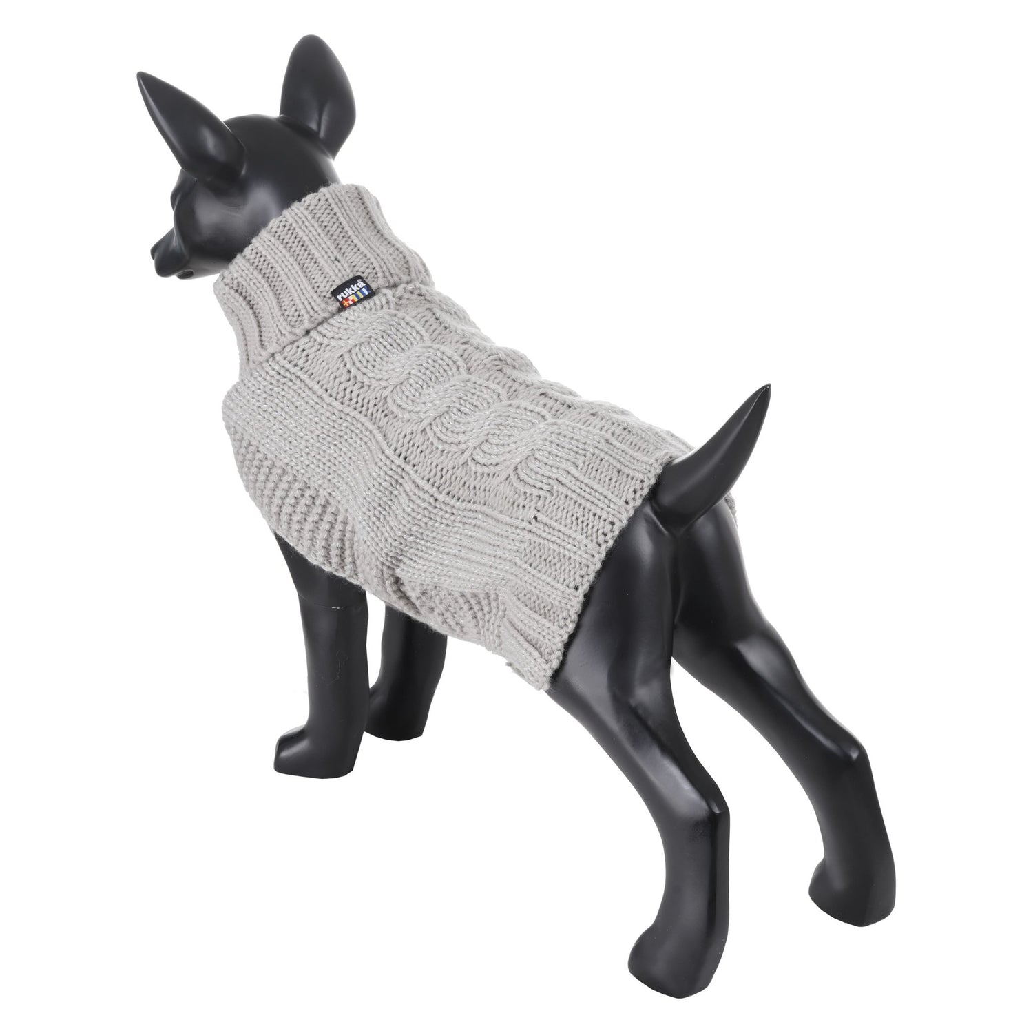 Dog wearing a gray knitted sweater on a black mannequin against a white background