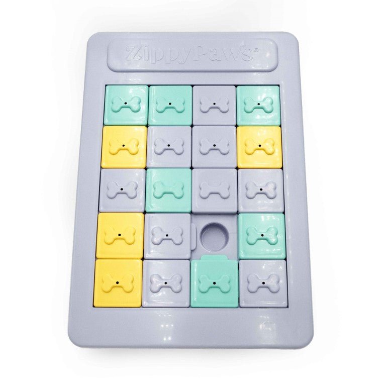 Colorful ice cube tray with bone and circle molds on a white background