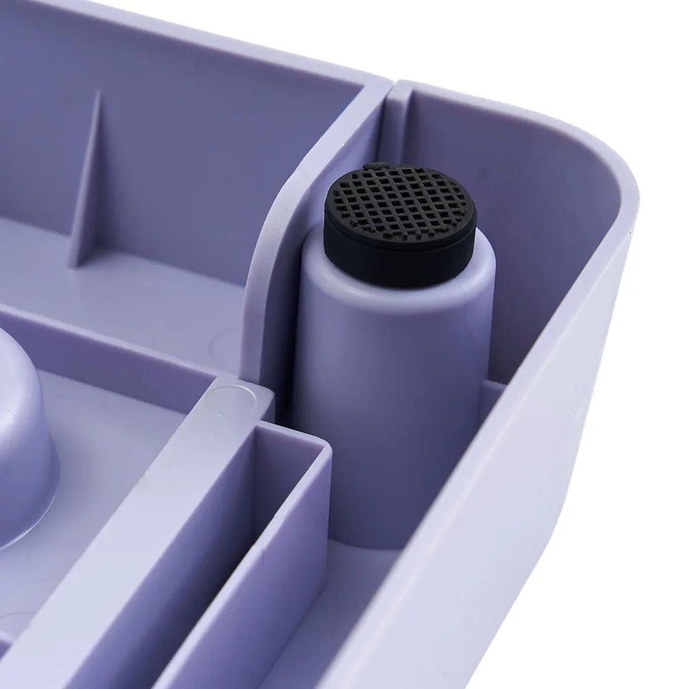 Purple container with a black mesh top on a white background